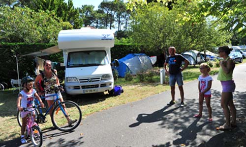 Motorhome in an alley of the park of Le Moussaillon campsite in Messanges