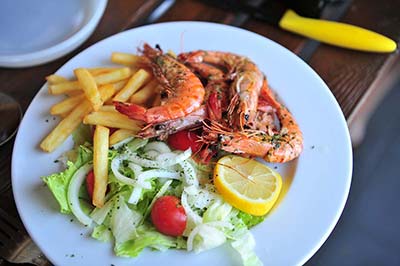 King prawns, fries and salad at the campsite restaurant near Vieux-Boucau