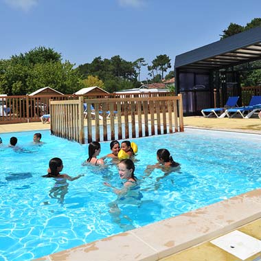 Children bathing in the swimming pool of the campsite near Hossegor in the Landes