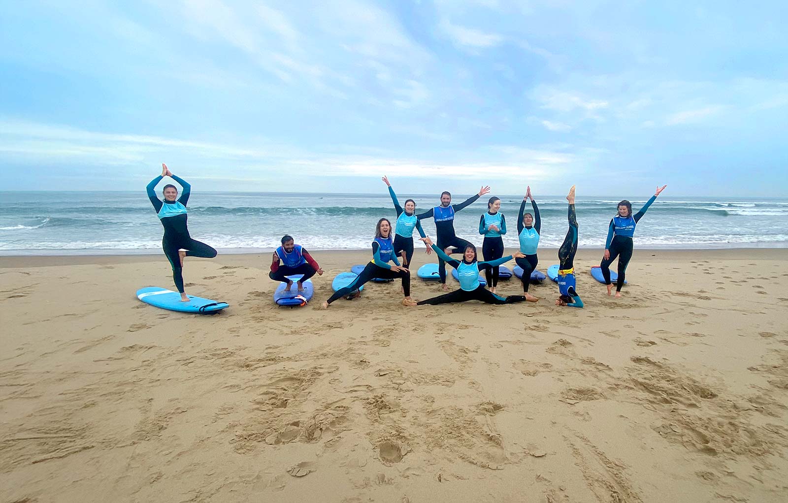 Surfers practicing yoga in the Landes